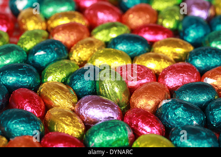 Colorful chocolate Easter eggs forming a background Stock Photo