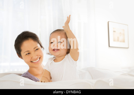 Mother and baby girl in living room