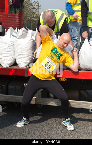 The World Coal Carrying Championship at Gawthorpe, West Yorkshire, on Easter Monday 2014. A male contestant Stock Photo