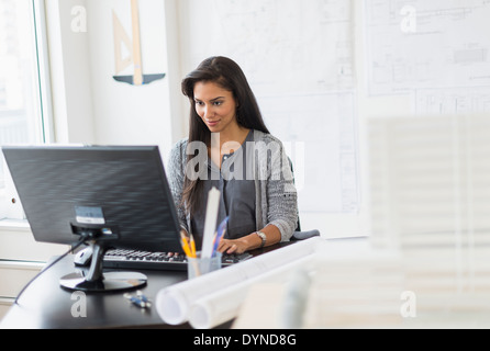 Hispanic architect working in office Stock Photo