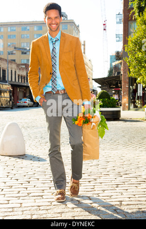 Full length portrait of a businessman carrying a money bag Stock Photo ...