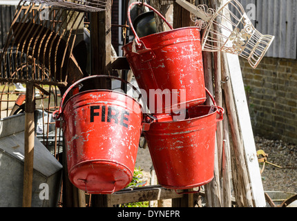 Old fire buckets hanging up Stock Photo