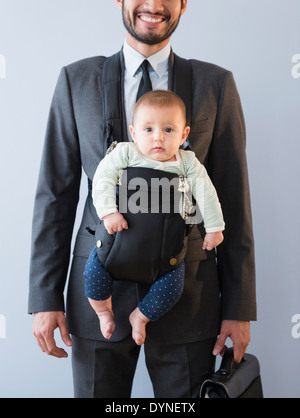 Full length portrait of a businessman carrying a money bag Stock Photo ...