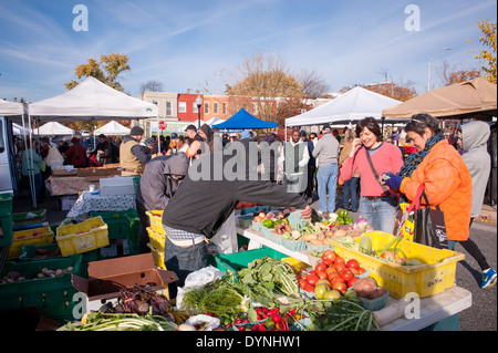 People buying produce at the Waverly Farmers Market in Baltimore, Maryland Stock Photo