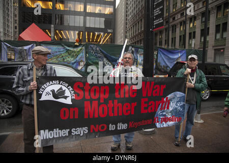 New York, NY, USA . 22nd Apr, 2014. Environmental activists rally on Earth Day at Zuccotti Park, then march to Wall Street calling for system change not climate change. The Occupy movement is still around in NYC it seems. Credit:  David Grossman/Alamy Live News