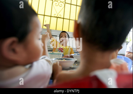 Children at lunch at Peace Village ward in Tudu Hospital in Ho Chi Minh City, VIetnam. Stock Photo