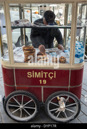 Simit bread vendor on the quay at Karakoy by Galata bridge, Istanbul, Turkey. Stock Photo