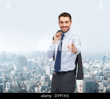 handsome buisnessman with jacket over shoulder Stock Photo