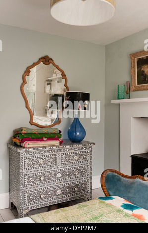 Folded Quilts On A Mother Of Pearl Inlay Chest Of Drawers By