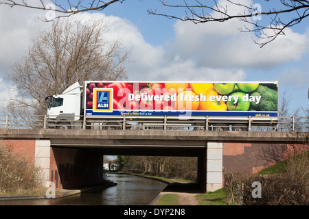 An articulated lorry delivering goods for the Aldi supermarket company. Stock Photo