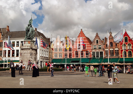 Market Square, pavement cafes, statue of Statue of Jan Breidel and Peter de Coninck, Bruges, Belgium Stock Photo