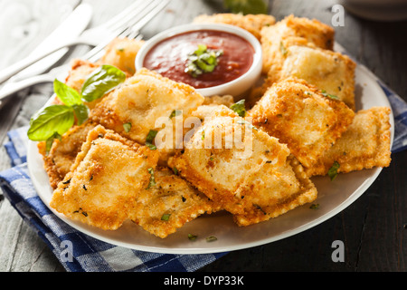 Homemade Fried Ravioli with Marinara Sauce and Basil Stock Photo