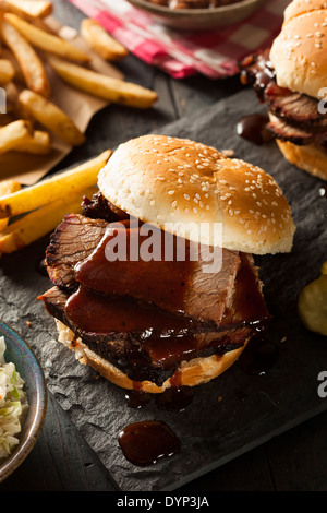 Smoked Barbecue Brisket Sandwich with Coleslaw and Bake Beans Stock Photo