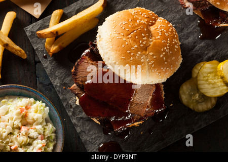 Smoked Barbecue Brisket Sandwich with Coleslaw and Bake Beans Stock Photo