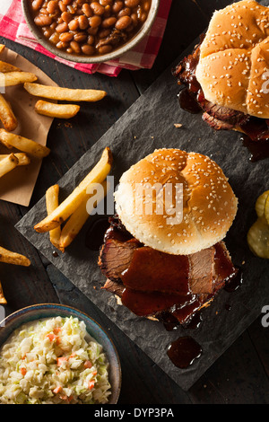 Smoked Barbecue Brisket Sandwich with Coleslaw and Bake Beans Stock Photo