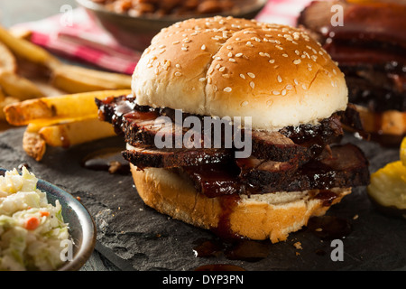 Smoked Barbecue Brisket Sandwich with Coleslaw and Bake Beans Stock Photo