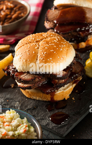 Smoked Barbecue Brisket Sandwich with Coleslaw and Bake Beans Stock Photo