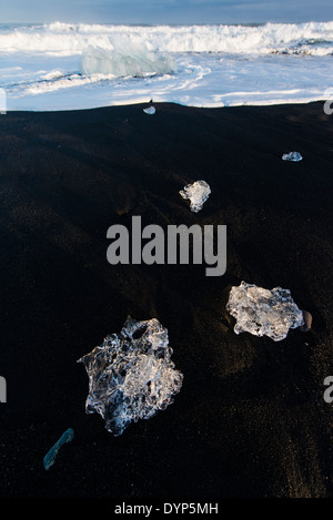 Packs of ice ejected derived from the Vatnajokull glacier are returned by the Atlantic ocean to the beach of Jokullsarlon, Iceland Stock Photo