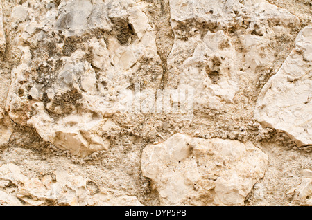 Full frame take of an old, irregular masonry wall Stock Photo