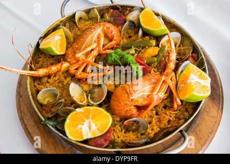 Deliciously cooked seafood paella dish with lobster. Stock Photo