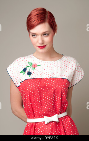 https://l450v.alamy.com/450v/dypaek/a-red-hair-woman-caucasian-woman-female-model-wearing-a-50s-dress-dypaek.jpg