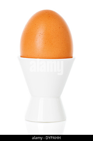 boiled Brown egg in cup, on a stand isolated on white Stock Photo