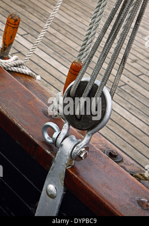 Boat equipment details, pulley, ropes and a part of broadside Stock Photo