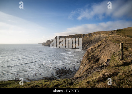 Landscape image looking over cliffs at sunrise out to sea Stock Photo