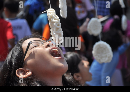 Cracker eating contest is one of the activities to celebrate the Republic of Indonesia Independence Day Stock Photo