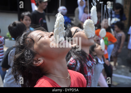 Cracker eating contest is one of the activities to celebrate the Republic of Indonesia Independence Day Stock Photo