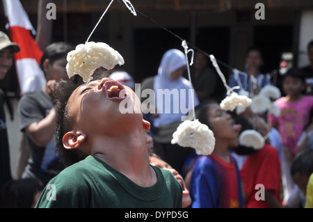 Cracker eating contest is one of the activities to celebrate the Republic of Indonesia Independence Day Stock Photo