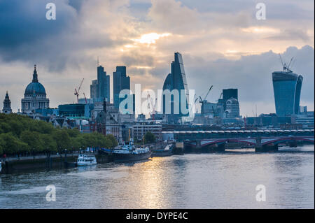 London ,UK. 24th April 2014.  Dark cloud formations over the skyscrapers of The City minutes after sunrise. Credit:  Piero Cruciatti/Alamy Live News Stock Photo