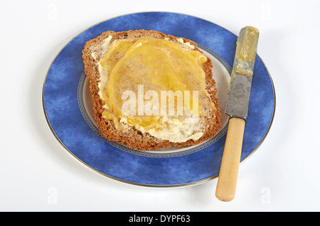 Lemon curd on wholemeal bread Stock Photo