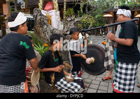 Galungan. Ubud Monkey forest. Ubud. Sacred Monkey Forest of Padangtegal. Several young people play music through the streets of Stock Photo