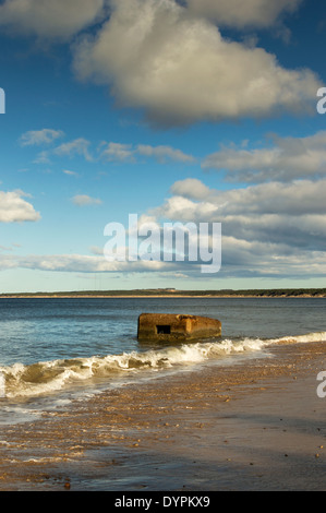 WORLD WAR II PILLBOX OR GUN EMPLACEMENT SUBMERGED BY INCOMING SEA ON THE  BEACH AT FINDHORN Stock Photo