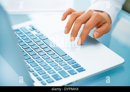 Close-up of hand woman using a laptop computer Stock Photo