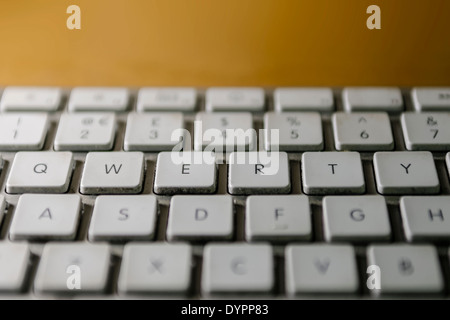 Grimy computer keyboard, focusing on QWERTY keys. Stock Photo