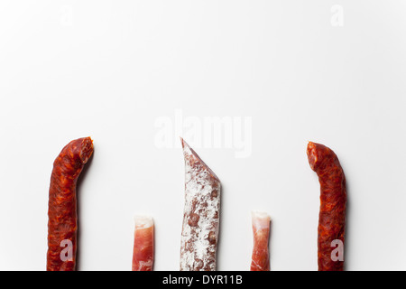 Rolls of spanish ham, chorizo and fuet sausages Stock Photo