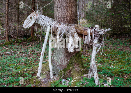 Deer sculpture made of wood and natural materials in a forest Stock Photo