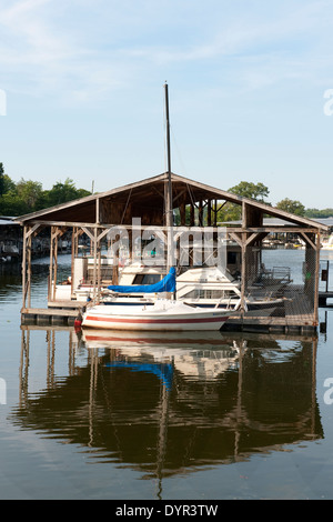 Sailboat reflecting pattern in the water Stock Photo