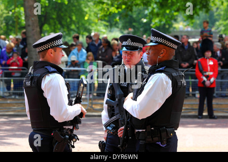 Metropolitan Police officers chat in Pall Mall before the Trooping the Colour ceremonies, London , England 2011 Stock Photo