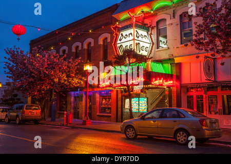 Restaurant in historic Chinatown lit up at night-Victoria, British Columbia, Canada. Stock Photo