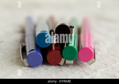 colorful pens with clips stacked on top of each other Stock Photo