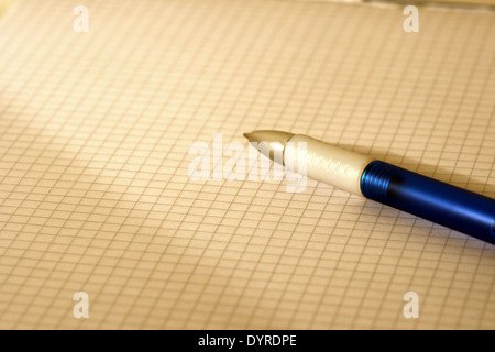 blue-white ballpoint writer on a block Stock Photo