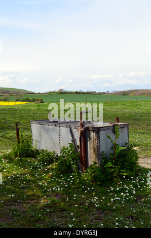 Livestock water trough in farm field. Stock Photo