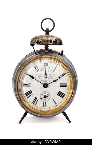 an old mechanical alarm clock on a white background Stock Photo