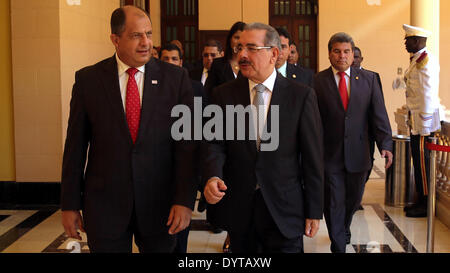 Santo Domingo, Dominican Republic. 24th Apr, 2014. Image provided by Dominican Republic's Presidency shows Dominican Republic President Danilo Medina (R, front) talking with the elected President of Costa Rica Luis Guillermo Solis (L, front) during his arrival at the Government House in Santo Domingo city, Dominican Republic, on April 24, 2014. Luis Guillermo Solis is visiting Central America and Dominican Republic to invite the leaders to his inauguration ceremony, according to local press. © Dominican Republic's Presidency/Xinhua/Alamy Live News Stock Photo