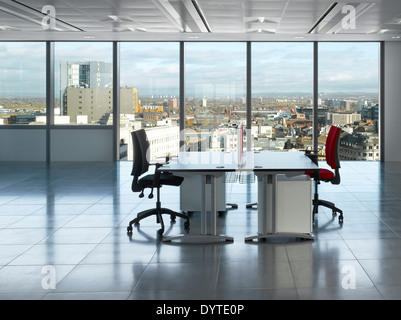 Desks and chairs in office space at No.1 New York Street, Manchester, Greater Manchester. Stock Photo