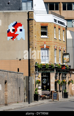 London, England, UK. Space invader tiled street art by 'Invader' (French urban artist) in Lambeth, Windmill pub Stock Photo