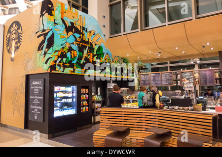 Los Angeles California,LAX,international airport,terminal,gate,Starbucks,coffee,barista,cafe,shop,drink drinks,snacks,snack food,man men male,woman fe Stock Photo